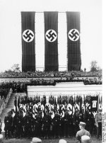 Nazi Party honor guard standing before the rostrum on which Adolf Hitler was addressing a rally, Nürnberg, Germany, 30 Aug-3 Sep 1933
