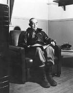 Kinkaid reading in his quarters on Adak, Aleutian Islands, 14 May 1943