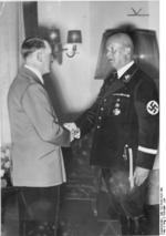 Adolf Hitler shaking Hans Lammers
