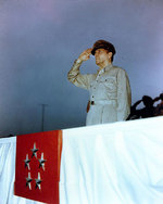 MacArthur saluted as he reviewed the American Independence Day parade at the Emperor
