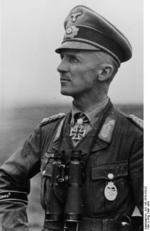 Hasso von Manteuffel with field glasses, May 1944. Note the Knights Cross with Oak Leaves and Swords and the Panzer Badge.