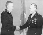 General George Marshall congratulates Lieutenant General Joseph McNarney after presenting him with the Distingushed Service Medal and the Legion of Merit, 1944