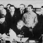 Japanese Foreign Minister Yosuke Matsuoka signing the Soviet-Japanese Neutrality Pact, Moscow, Russia, 13 Apr 1941, photo 3 of 3; note Vyacheslav Molotov and Joseph Stalin in background