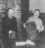 Joseph Stalin presenting the coat of arms of Poland with Vyacheslav Molotov at his side, 15 Nov 1944