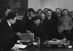 Japanese Foreign Minister Matsuoka signing the Soviet-Japanese Neutrality Pact, 13 Apr 1941, photo 2 of 3; note Molotov and Stalin in background