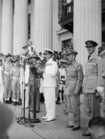 Supreme Allied Commander South East Asia Admiral Lord Louis Mountbatten delivering an address at the Municipal Building, Singapore, 12 Sep 1945, photo 1 of 2; note William Slim, Raymond Wheeler, and Keith Park