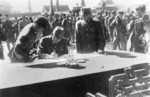 Hiroshi Nemoto signing the surrender document at the Forbidden City, Beiping, China, 10 Oct 1945, photo 1 of 3
