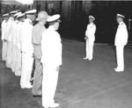 Admiral Nimitz addressing officers immediately after assuming command of Pacific Fleet, Pearl Harbor, US Territory of Hawaii, 31 Dec 1941; Admiral Kimmel at right