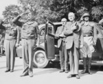 Major General Floyd Parks, John McCloyd, US Secretary of War Henry Stimson, and General George Patton during the review of US 2nd Armored Division, Berlin, Germany, 20 Jul 1945
