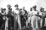Colonel Lewis Puller, General Douglas MacArthur, General Oliver Smith, and other US officers at Puller
