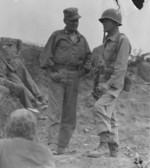 US Marine Colonel Chesty Puller (left) speaks with Assistant Division Commander Brigadier General Edward Craig overlooking Seoul, South Korea, 25 Sep 1950, photo 2 of 2