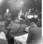 German Army Major General Erwin Rommel studying maps with officers, France, May-Jun 1940