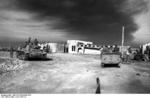 Erwin Rommel and Fritz Bayerlein inspecting Toburk, Libya, circa Jun 1942; note Panzer III tank to the left