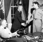USAAF B-17 Flying Fortress bomber radio operator Technical Sergeant Forrest L. Vosler receiving the Medal of Honor from US President Franklin Roosevelt, 6 Sep 1944