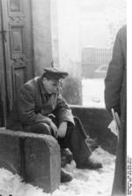 Albert Speer sitting on doorsteps, 22 Dec 1942
