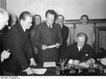 Ribbentrop signing the German-Soviet non-aggression pact, Moscow, Russia, 23 Aug 1939, photo 1 of 3; Shaposhnikov, Molotov, and Stalin in back row