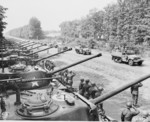 Major General Frank Parks, General George Patton, Colonel W. H. Kyle, J. J. McCloy, H. H. Bundy, and US Secretary of War Henry Stimson, reviewing US 2nd Armored Division, Berlin, Germany, 20 Jul 1945, photo 3 of 4