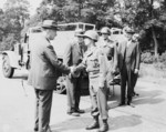 Major General Frank Parks, General George Patton, Colonel W. H. Kyle, J. J. McCloy, H. H. Bundy, and US Secretary of War Henry Stimson, reviewing US 2nd Armored Division, Berlin, Germany, 20 Jul 1945, photo 4 of 4