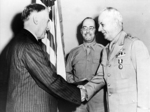 US Secretary of War Henry Stimson awarding Lieutenant General Delos Emmons the Distinguished Service Medal, Jul 1943; Brigadier General H. B. Lewis in background