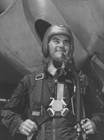 Tibbets posing in front of an aircraft in full pilot gear, date unknown