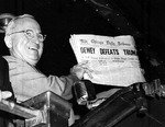 Truman holding a copy of Chicago Tribune that mistakenly anticipated his defeat in the 1948 election by Thomas Dewey, Union Station, St. Louis, Missouri, United States, 3 Nov 1948, photo 1 of 2