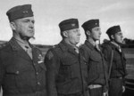 MGen A. Vandegrift, Col M Edson, 2Lt M. Paige, and Plt. Sgt. J. Basilone at US 1st Marine Division Medal of Honor ceremony, Balcombe, Australia, 21 May 1943, photo 1 of 2