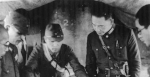 Wang Jingwei studying a map during a military exercise, China, 1940s; note presence of Japanese officers