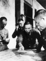 Xue Yue studying a map with his staff officers, date unknown