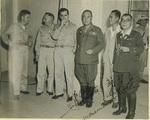 John Dorle, Harry Clarke, Milton Sandberg, Tomoyuki Yamashita, Hamamoto, and Akira Muto during a break from court, Oct 1945; note the autographs by Yamashita, Hamamoto, and Muto