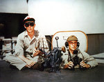 Marines Corporal Osborne Cheek and Platoon Sergeant George W. Ewell at their post atop a 5-in gun aboard Alaska, Feb 1945