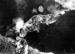Carriers Amagi (near bomb splashes) and Katsuragi (center-right, heavily camouflaged) under attack, Kure, Japan, 24 Jul 1945