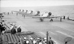 Six Skua aircraft of No. 800 Squadron Fleet Air Arm lining up on deck before taking off from Ark Royal, Apr 1941