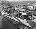 Baltimore overhauled at Mare Island Navy Yard, 21 Oct 1944, cruiser Indianapolis in background