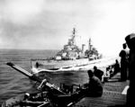 British cruiser HMS Belfast alongside American light carrier USS Bataan off the coast of Korea, 27 May 1952; note Bataan