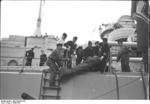 Men working aboard battleship Bismarck, 1940-1941