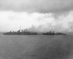 USS Blue and USS Patternson removing the crew from the fatally damaged Canberra 9 Aug 1942
