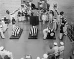 Aboard USS Canberra, US Navy Hospitalman William R. Charette selecting the Unknown Serviceman of WW2 for burial in Arlington National Cemetery; off Virginia, United States, 26 May 1958