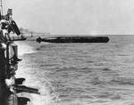 Concord firing a torpedo from port side, circa mid-1920s
