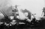 Cruiser Dupleix aflame at Toulon, France, circa 27 Nov 1942