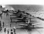 One SBD Dauntless and five TBD-1 Devastator aircraft prepared to take off from Enterprise, South Pacific, 4 May 1942