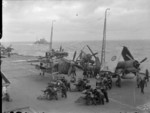 Barracuda and Corsair aircraft aboard HMS Formidable in the Norwegian Sea, Aug 1944; note HMS Berwick in background