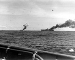 Carriers Belleau Wood and Franklin afire after being hit by suicide aircraft, off Samar, Philippine Islands, 30 Oct 1944