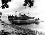 Japanese Type A Ko-hyoteki midget submarine and transport Yamazuki Maru beached on Guadalcanal, Solomon Islands, 1 May 1944