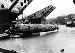 US Navy salvaging a Japanese Type A Ko-hyoteki midget submarine from shallows around Okinawa, Japan, 1945