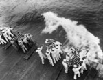 Burial at sea aboard USS Hancock for those killed by Japanese special attack two days prior, off Okinawa, Japan, 9 Apr 1945