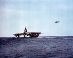 F6F Hellcat fighter landing on USS Hancock, circa 1944; note Hancock