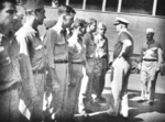 Admiral Walden Ainsworth meeting Captain Charles Carpenter (right) and survivors of USS Helena, 7 Jul 1943