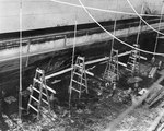 Cruiser Honolulu drydocked for damage suffered during Pearl Harbor attack, Pearl Harbor Navy Yard, 13 Dec 1941, photo 2 of 2