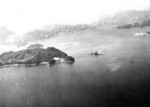 Hyuga sunken in shallow water, near Kure, Japan, 28 Jul 1945; photo taken by USS Shangri-La aircraft