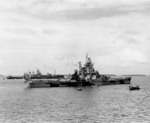 Battleship Indiana at Majuro, Marshall Islands for repairs after collison with battleship Washington, 3 Feb 1944; note Washington and AR-4 Vestal in background